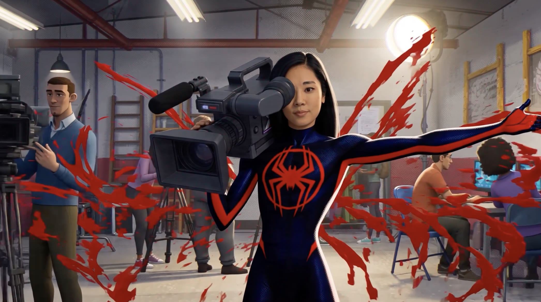 Jenny Woo carrying a camera on a busy production set